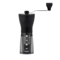Ruční mlýnek na kávu Hario Mini Mill Slim PLUS černý s průhlednou spodní nádobou a kovovým madlem