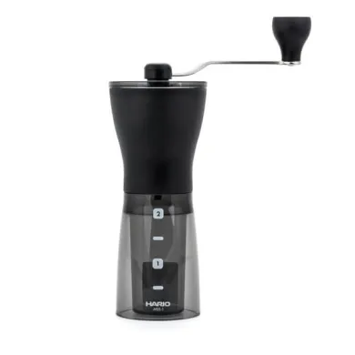 Ruční mlýnek na kávu Hario Mini Mill Slim PLUS černý s průhlednou spodní nádobou a kovovým madlem