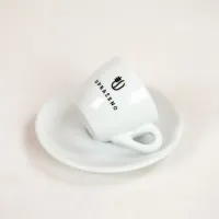 bílý keramický šálek s podšálkem UPRAŽENO