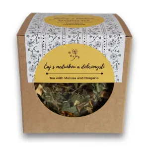 Čaj s meduňkou a dobromyslí balení z hnědého kartonu žlutý kulatý štítek kruhové okénko s čajovými listy uvnitř