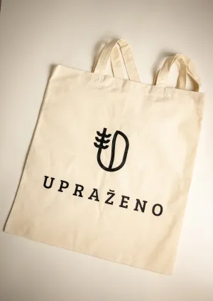 přírodní plátěná taška s černým logem a nápisem UPRAŽENO